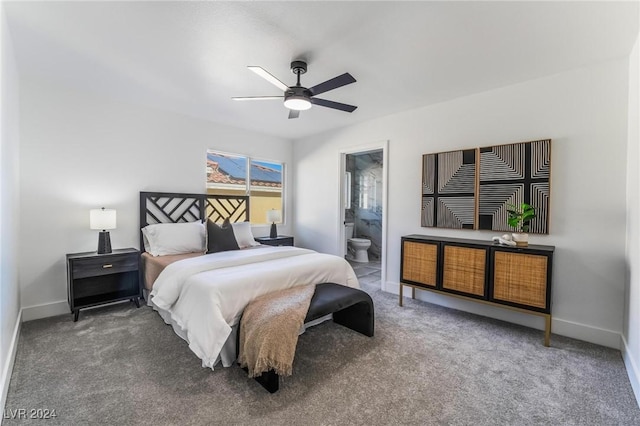 carpeted bedroom with ceiling fan and ensuite bath