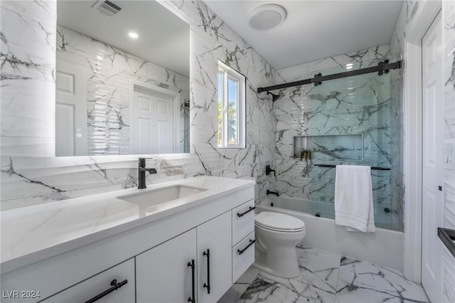 full bathroom featuring combined bath / shower with glass door, vanity, and toilet