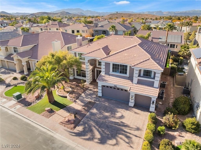 birds eye view of property featuring a mountain view