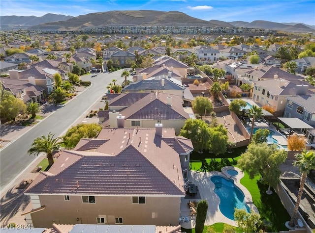 birds eye view of property with a mountain view