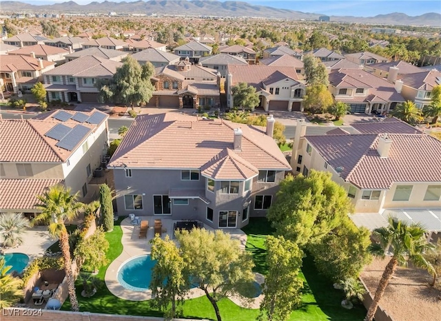 birds eye view of property with a mountain view