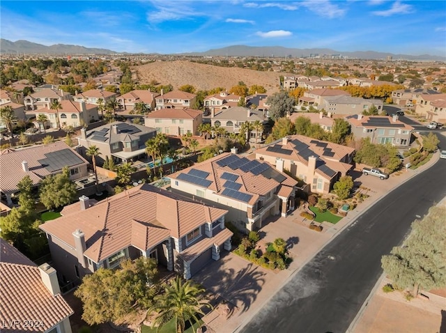 birds eye view of property featuring a mountain view