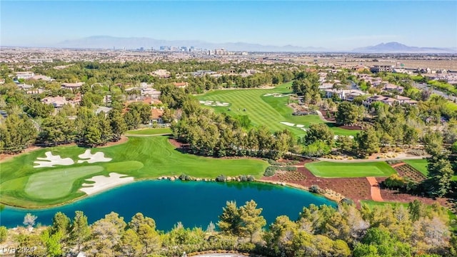 birds eye view of property with a water and mountain view