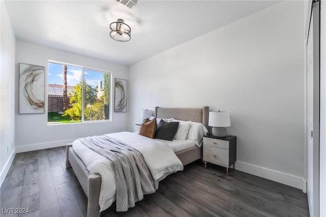 bedroom featuring dark wood-type flooring