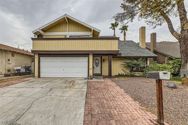 view of front property with a balcony and a garage