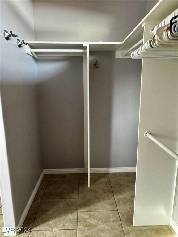 walk in closet featuring tile patterned floors