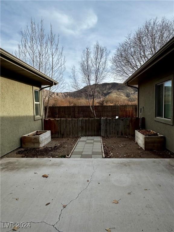 view of patio / terrace with a mountain view