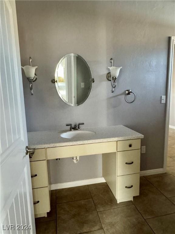 bathroom with tile patterned flooring and vanity