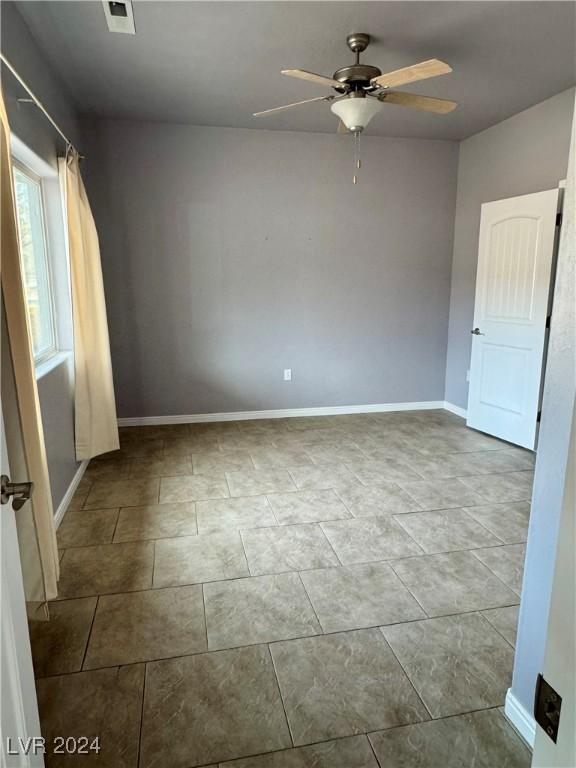 unfurnished room with ceiling fan