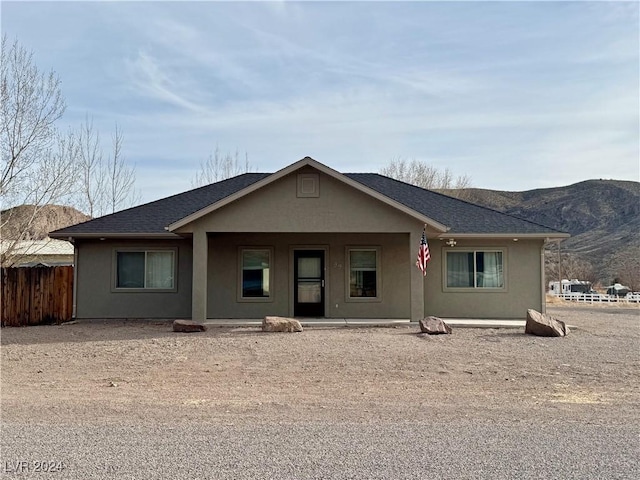 single story home with a mountain view