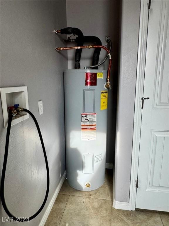 utility room featuring electric water heater