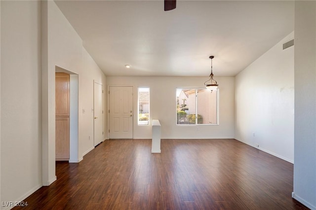 spare room with dark hardwood / wood-style floors