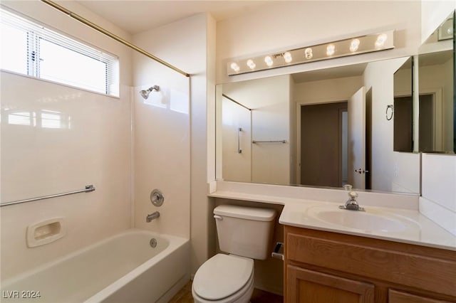 full bathroom featuring bathing tub / shower combination, vanity, and toilet