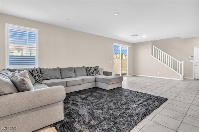 living room with light tile patterned flooring