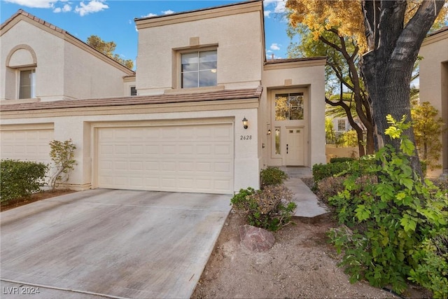 view of front of property with a garage