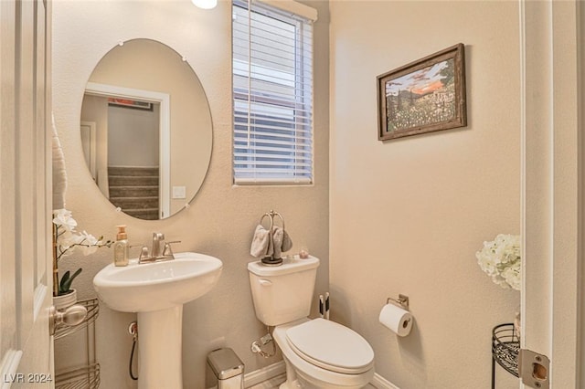 bathroom with toilet and sink