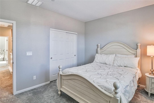 carpeted bedroom with a closet