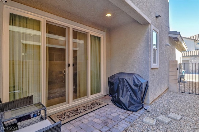 entrance to property featuring a patio area