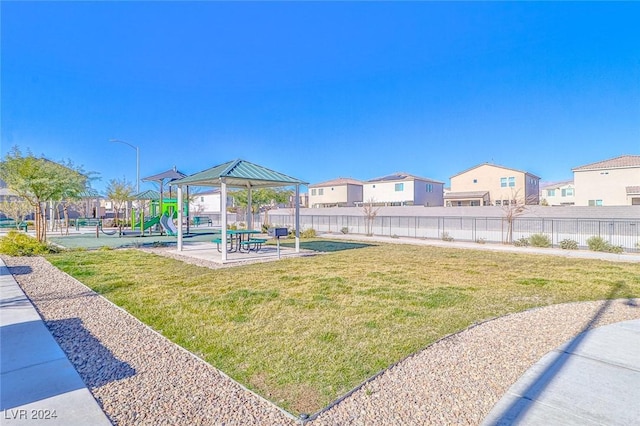 view of yard featuring a gazebo and a playground