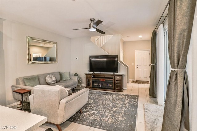 tiled living room with ceiling fan