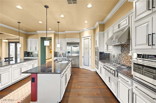 kitchen featuring stainless steel appliances, white cabinetry, dark hardwood / wood-style floors, and an island with sink