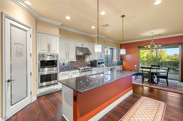 kitchen with sink, white cabinets, a healthy amount of sunlight, and dark hardwood / wood-style floors