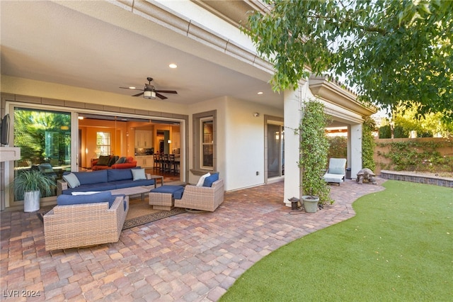 view of patio featuring an outdoor living space and ceiling fan