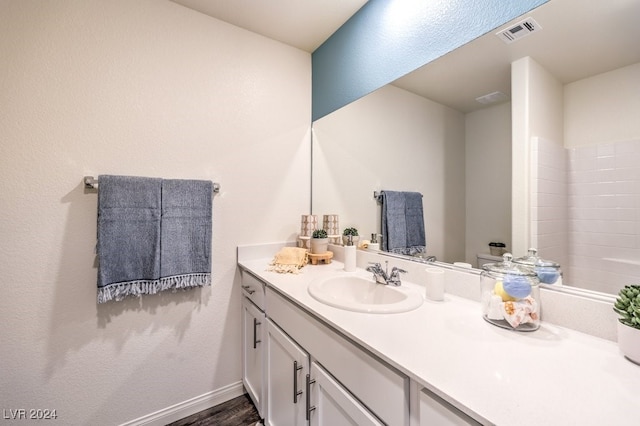 bathroom featuring vanity and wood-type flooring