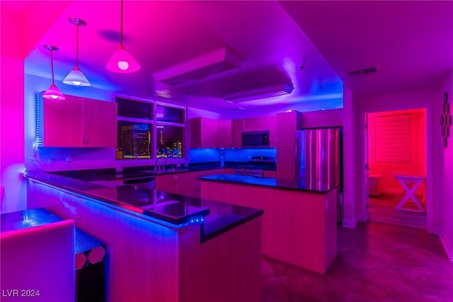 bar featuring decorative light fixtures, sink, fridge, a tray ceiling, and stove