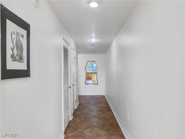 hallway featuring tile patterned floors