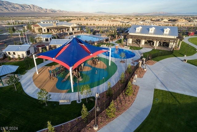 birds eye view of property with a mountain view