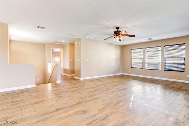 unfurnished room featuring light wood-type flooring and ceiling fan