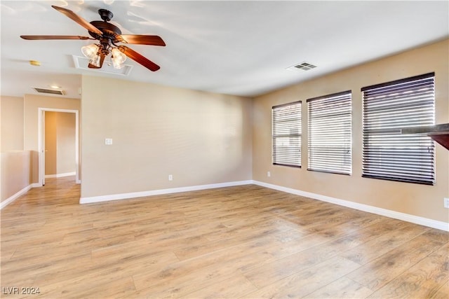 unfurnished room featuring ceiling fan and light wood-type flooring