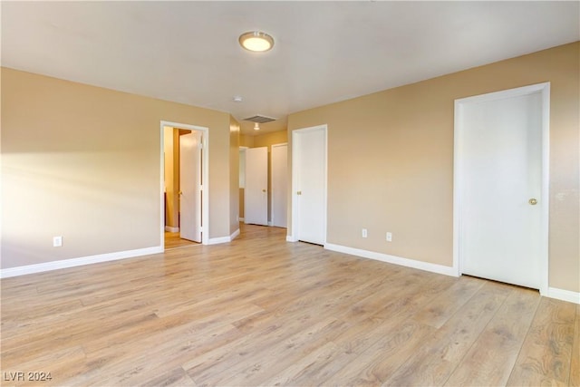 empty room with light wood-type flooring