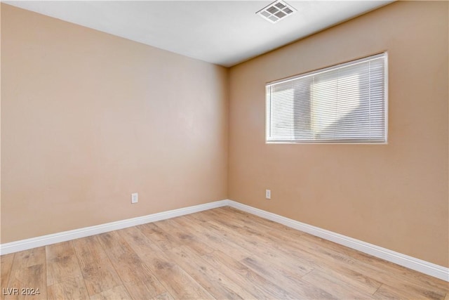 spare room featuring light hardwood / wood-style floors