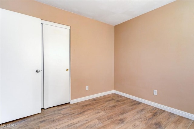 unfurnished bedroom featuring light wood-type flooring