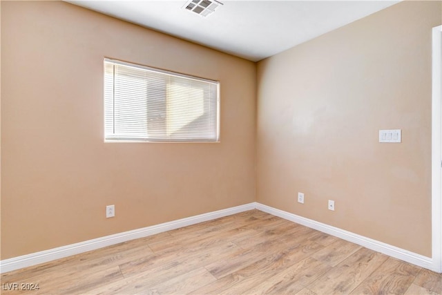 spare room featuring light hardwood / wood-style floors