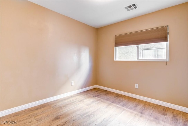 spare room featuring light wood-type flooring