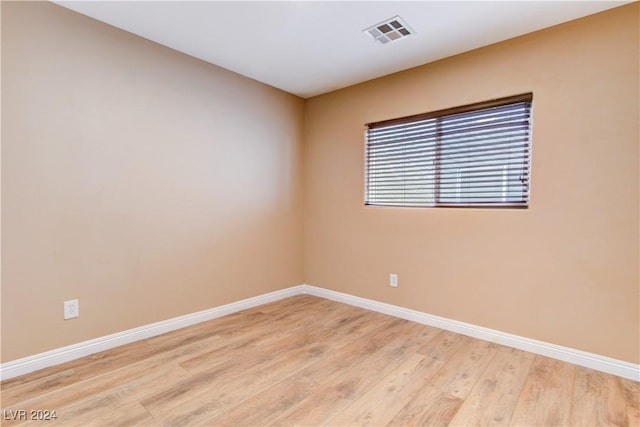 unfurnished room featuring light wood-type flooring