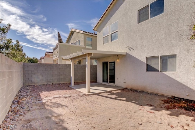 back of house with a patio