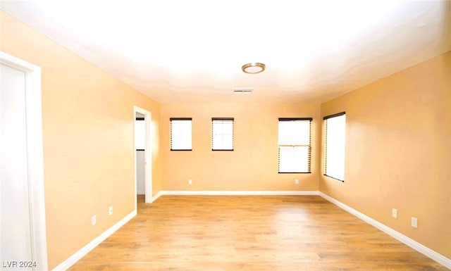 spare room with light hardwood / wood-style flooring