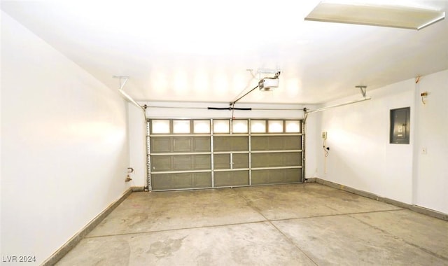 garage featuring electric panel and a garage door opener