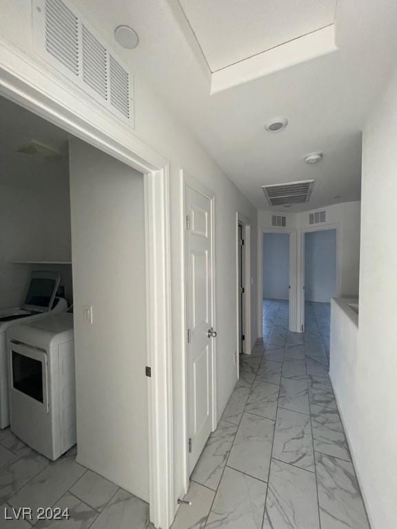 hall with washer / dryer