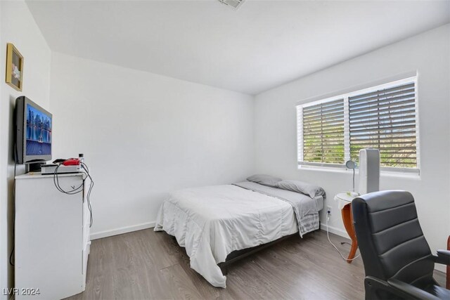 bedroom featuring hardwood / wood-style floors