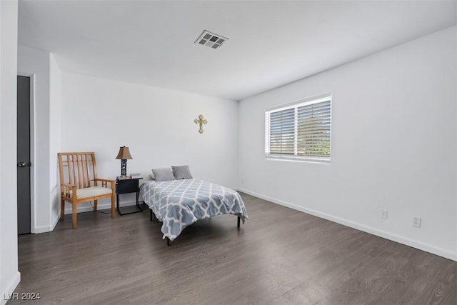 bedroom featuring dark hardwood / wood-style floors