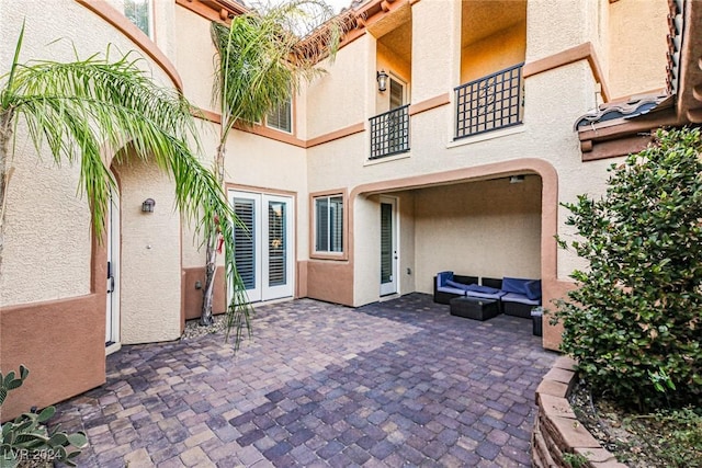 view of patio with outdoor lounge area and french doors