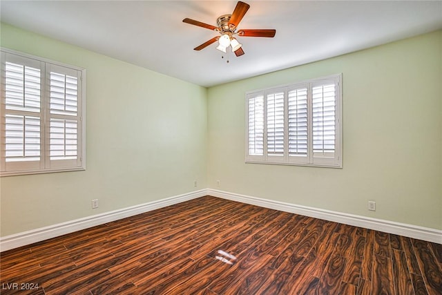 empty room with ceiling fan and hardwood / wood-style flooring