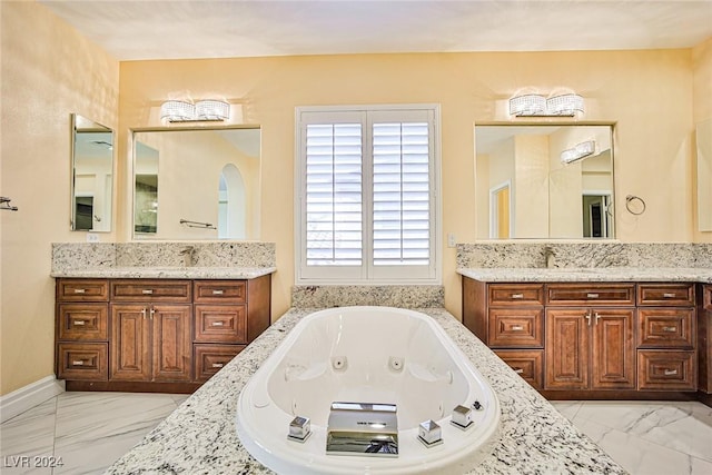 bathroom with a bathtub and vanity