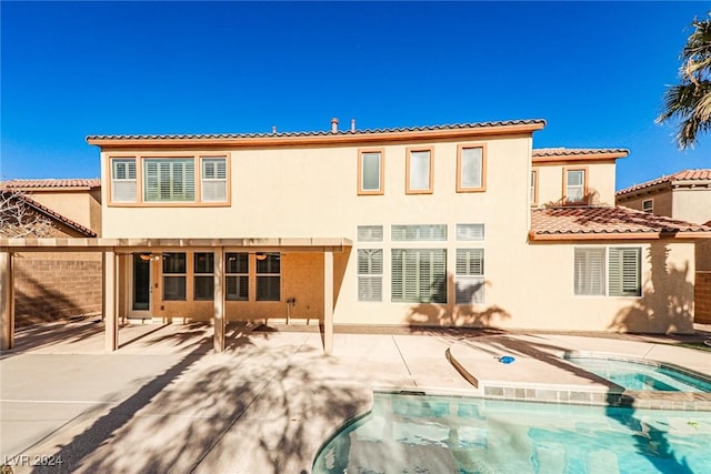 rear view of property with a patio area