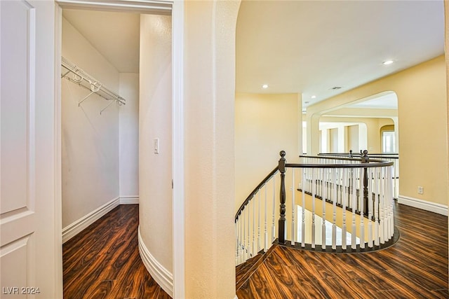 stairway with hardwood / wood-style floors